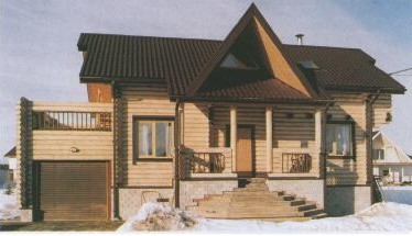 Одноэтажный дом из 
оцилиндрованного бревна с мансардой и пристроенным гаражом ('Петроспект-Центр')